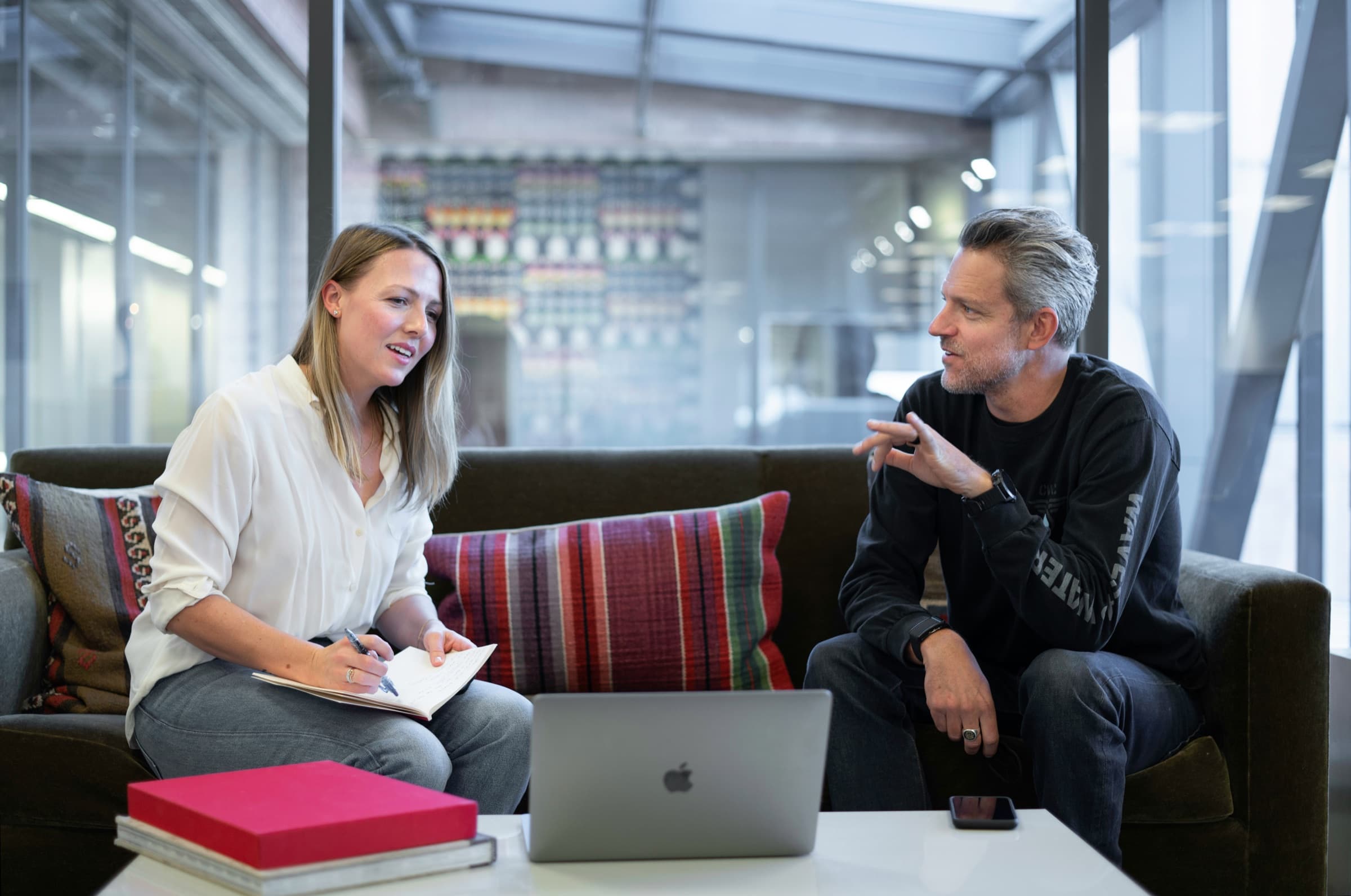 A team gathered around a table in a client meeting